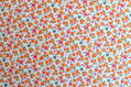 Mini oranžové kvietky na ecru - fine cotton, poplin