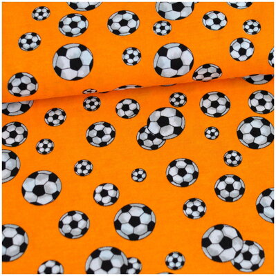 Futbalové lopty na oranžovom jersey